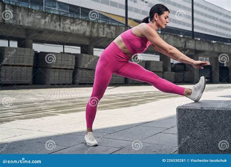 Female Bending Forward While Doing Leg Stretch Stock Image Image Of Fitness Fulllength 226530281