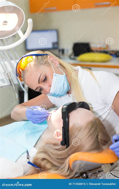 Woman Doctor Dentist Filling Tooth To Her Patient Stock Image Image