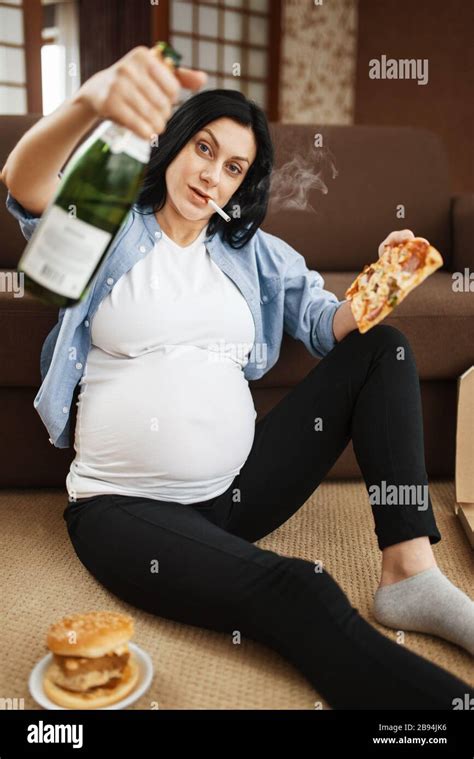 Pregnant Woman Smoking And Drinks Alcohol Stock Photo Alamy