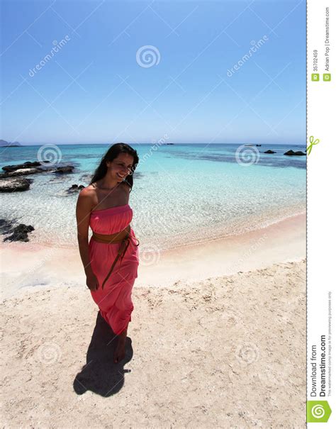 Sexy Girl Walking On The Beach In A Coral Dress Royalty