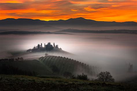 A Building Emerges From The Early Morning Fog In Belvedere Farm In San