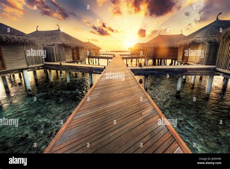 Wooden Jetty Towards Water Villas Maldives Island Resort On Indian
