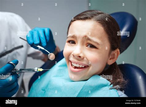 Scared Girl Sit In Dental Chair In Room She Afraid Of Dentist And