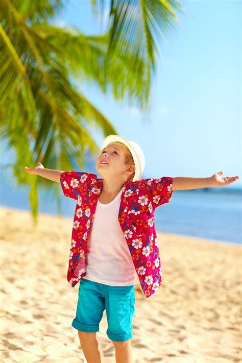 Young Fashionable Boy Enjoys Life On Tropical Beach Stock Image Image