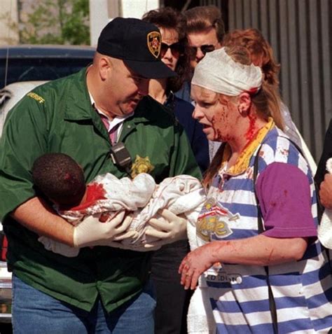 A Police Officer Helps Victims Of The Oklahoma City Bombing On April 19