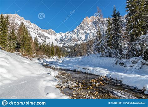 Sunny Winter Landscape In The Alps Mountain Range River
