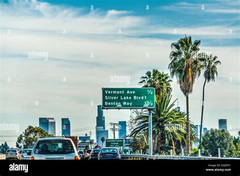 Traffic On The Freeway With Downtown Los Angeles On The Background