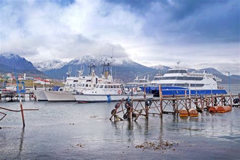 View Of Ships In The Port Of Ushuaia Against A Landscape Showing The