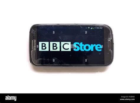 The Bbc Store Logo On The Screen Of Smartphone Photographed Against A