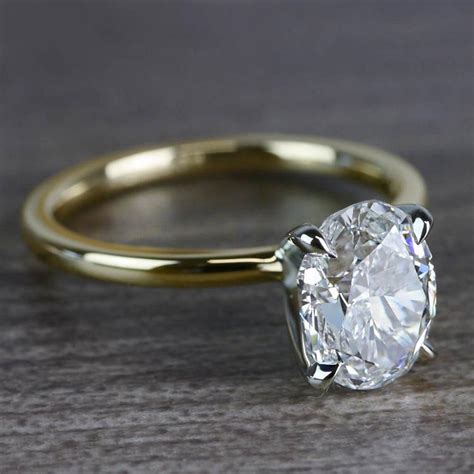 Don't get ripped off by understanding how color, cut and clarity impact price. Outstanding Two-Tone Oval Shape 2 Carat Diamond Ring
