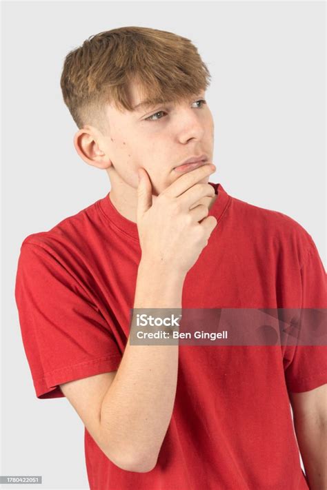 Headshot Of A Thinking Teenage Boy Stock Photo Download Image Now