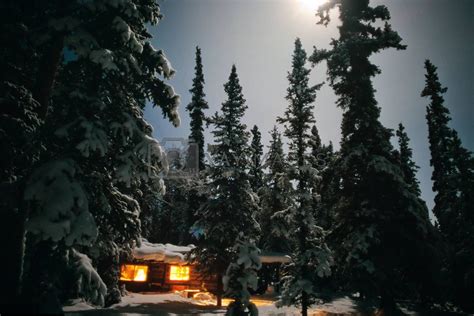 Cozy Log Cabin At Moon Lit Winter Night Royalty Free Stock