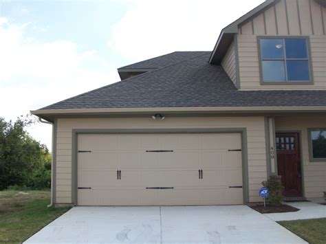 Steel carriage garage doors