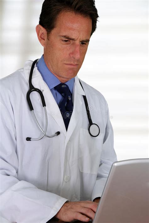 Doctor with Hand on Chin stock photo. Image of labcoat - 27929990