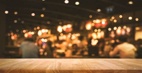 Wood Table Top Bar With Blur Light Bokeh In Dark Night Cafe