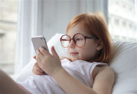 Photo Of Child Using Smartphone · Free Stock Photo