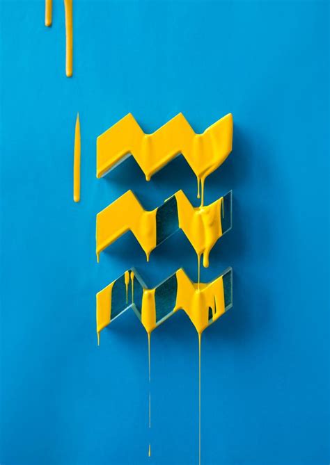 Yellow Paint Dripping Down The Side Of A Blue Wall