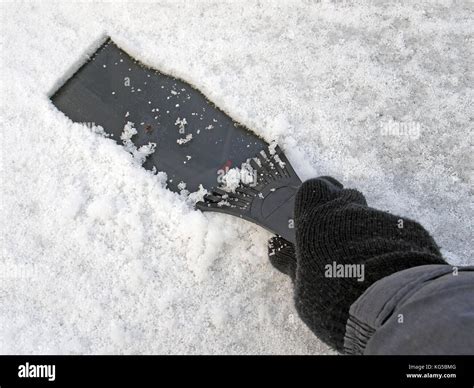 Righ Hand In Glove Cleaning Snow From Car Window Stock Photo Alamy