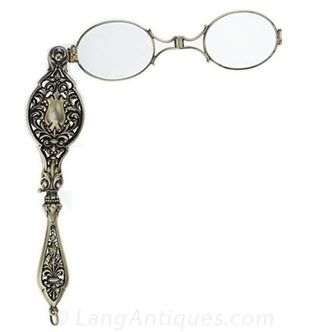 A Wonderful Double Sided Silver Lorgnette With Extravagant Open Pierced Work And Plentiful