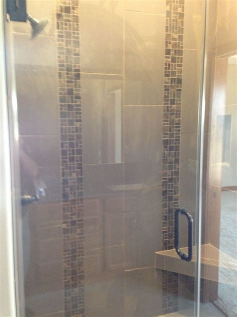 Custom Tile Shower With Two Vertical Stone And Glass Tile Mosaic