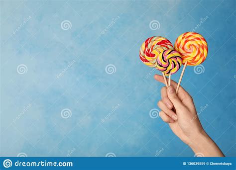 Woman Holding Yummy Candies On Color Background Stock Image Image Of