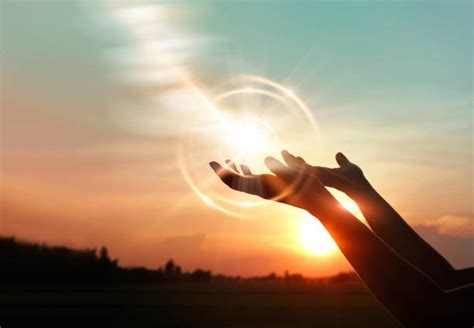 Woman Hands Praying For Blessing From God On Sunset Background Holy