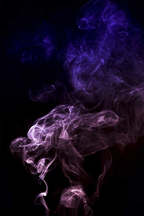 Abstract Pink And Blue Smoke Spread On Black Background Free Photo