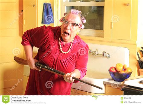 Fearful Granny With Rifle Royalty Free Stock Images