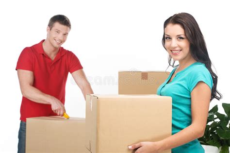 Couple Moving Boxes And Unpacking Stuff Stock Image Image Of Plant