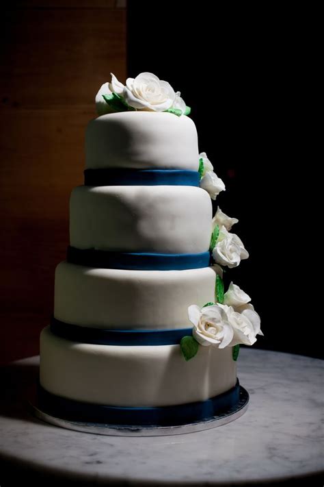 White Rose Wedding Cake With Blue And Green Accents White Roses