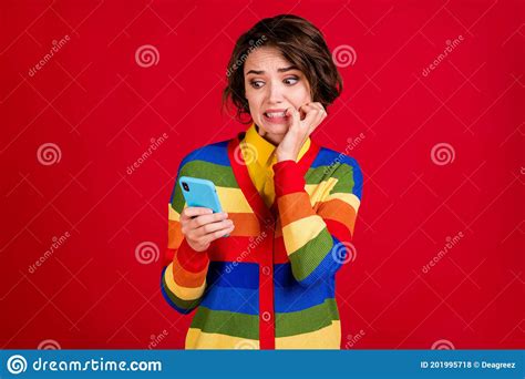 Photo Of Beautiful Terrified Lady Hold Telephone Frightened Bite Fingers Read Negative Bad News