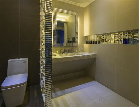 Nice And Neat Bathroom With White And Brown Tiles And Beautiful