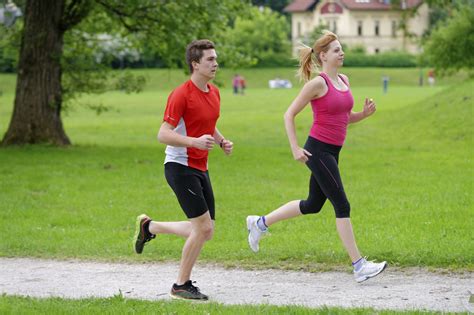 Young Couple Jogging In Park At Morning Health And Fitness Allulose
