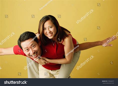 Man Carrying Woman On Back Arms Stock Photo 573692677 Shutterstock