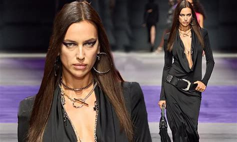 Irina Shayk Shows Off Her Flawless Physique In A Black Mini Dress For