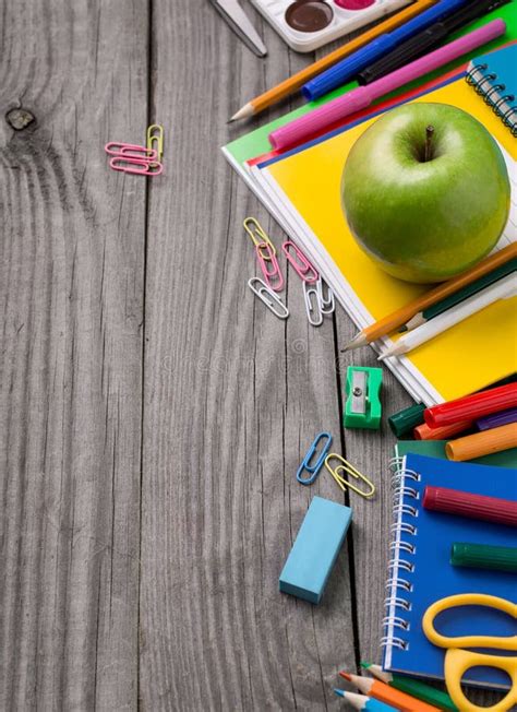 School Supplies With Green Apple On The Wooden Table Stock Image