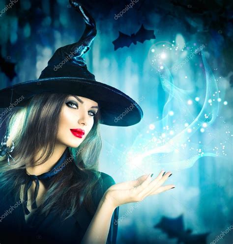 Halloween Witch Holding Magical Light Stock Photo By ©subbotina 87436888