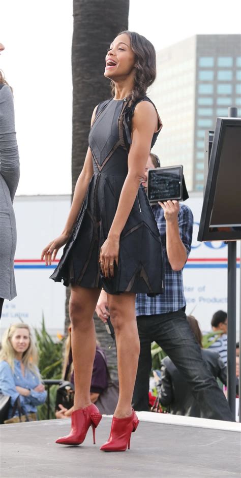Zoe Saldana Wearing Black Partially See Through Mini Dress On Extra Set At The Porn Pictures