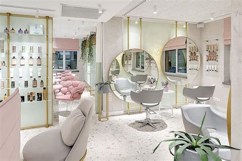 A Salon With Mirrors And Chairs In It