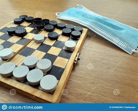 Checkerboard With Checkers Business Strategy Planning Stock Photo