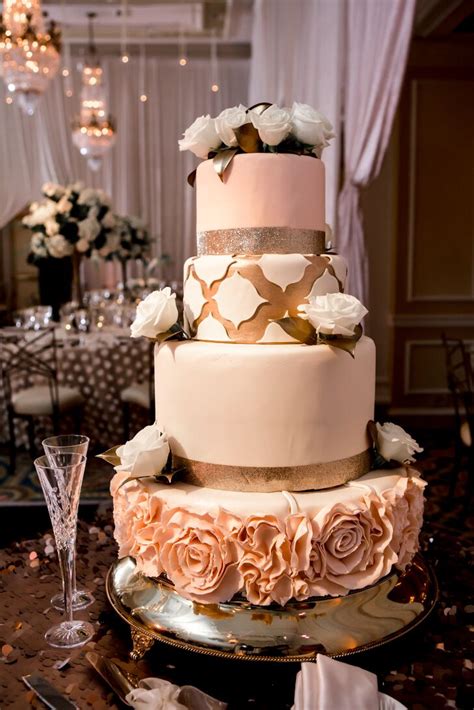 Intricate Four Tier Wedding Cake In Blush Gold And Ivory