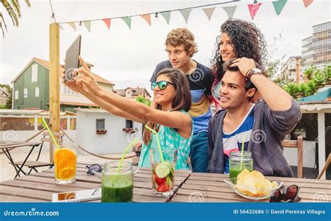 Group Of Young People Taking A Selfie With Tablet Stock Photo Image