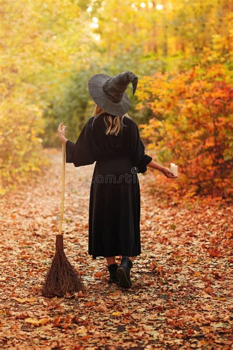 Unrecognizable Witch Walking In Autumn Forest Stock Image Image Of