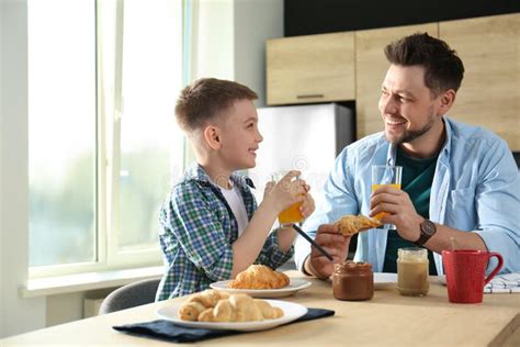 Dad And Son Having Breakfast Together In Stock Image Image Of Adult Male 155999437