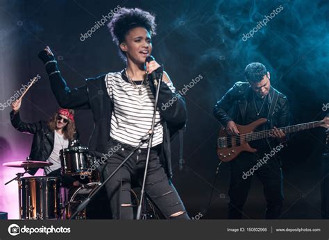 Rock Band On Stage — Stock Photo © Tarasmalyarevich 150802966