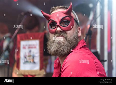 Man Dressed As The Devil Playing The Violin At A Music Festival Stock