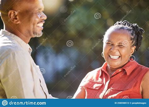 Happy Affectionate Mature African American Couple Sharing An Intimate Moment Outside At The Park