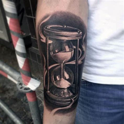 The expression of art through hourglass tattoo shows the darker side of skull and death, relating to the uncontrollable passage of time.although this reality somehow scares us all, it also stands as the source of inspiration to make the wisest use of time. 60 Hourglass Tattoo Designs For Men - Passage Of Time