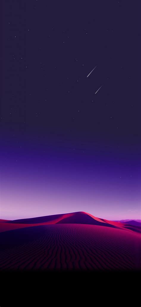 The Night Sky Is Lit Up With Stars And Pink Sand Dunes In The Foreground