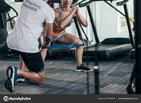 Cropped View Personal Trainer Instructing Young Sportswoman Exercising
